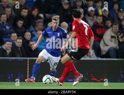 Wade Elliott (a sinistra) di Birmingham City e Peter Whittingham di Cardiff City combattono per la palla Foto Stock