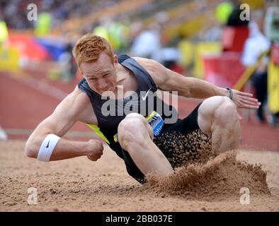 Greg Rutherford in azione in Gran Bretagna durante il concorso Long Jump Foto Stock
