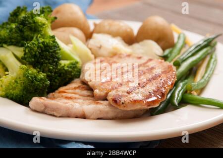 Una cotoletta di maiale alla griglia Foto Stock