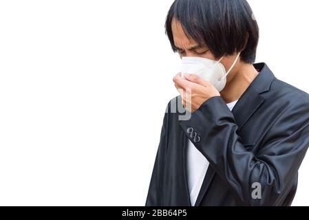 Un uomo asiatico indossa maschera N95 e tosse azione Foto Stock