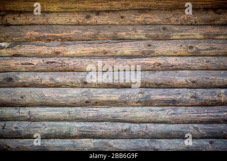 Sfondo in legno. Vecchio muro di legno di una casa rustica con texture. Foto Stock