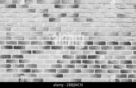 Bel muro in mattoni bianchi e neri, loft. Struttura di muro di mattoni o sfondo. Foto Stock