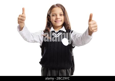 Scolaretta in uniforme che mostra pollici su isolato su sfondo bianco Foto Stock