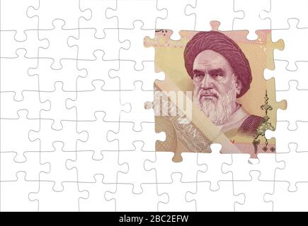 Primo piano sulle banconote dei riali iraniani. Puzzle. Rial è la valuta nazionale dell'Iran Foto Stock