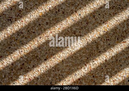texture di sfondo: l'ombra cade sul pavimento in pietra. Foto Stock