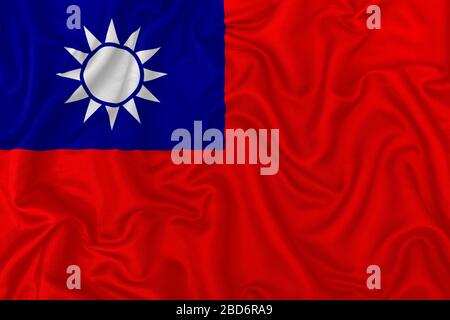 Bandiera della Repubblica della Cina su sfondo di tessuto di seta ondulato. Foto Stock
