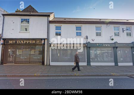 Nella foto: Negozi chiusi nel centro di Swansea, Galles, Regno Unito. Mercoledì 25 Marzo 2020 Re: Covid-19 Coronavirus pandemic, UK. Foto Stock