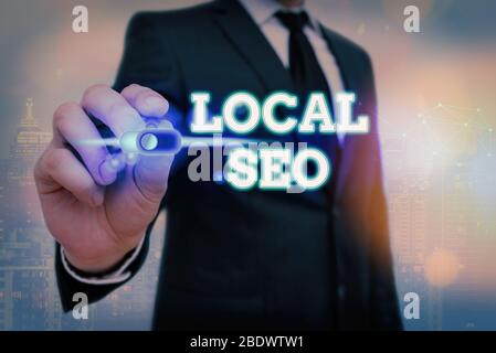 La scrittura della nota mostra Seo locale. Il concetto di business per ottimizzare il vostro sito web di rango migliore per un pubblico di utenti locali Foto Stock