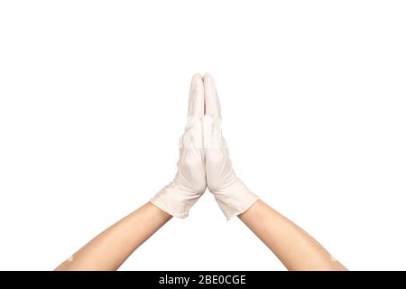 Anjali Mudra o Namaste gesto in lattice chirurgico segno guanto contro sfondo bianco. Mano in un guanto in lattice bianco isolato su bianco. Donna mano ge Foto Stock