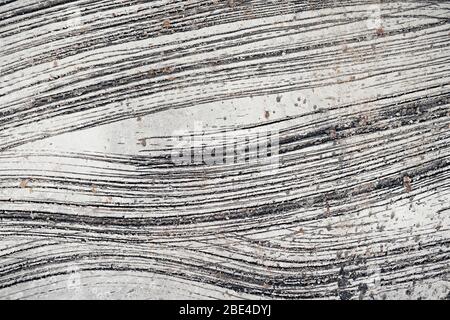 tessitura di fondo muro di cemento con crepe e graffi Foto Stock