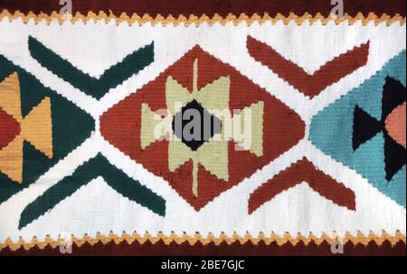 Texture of handmade wool rug with traditional iranian geometric pattern, Iran Foto Stock
