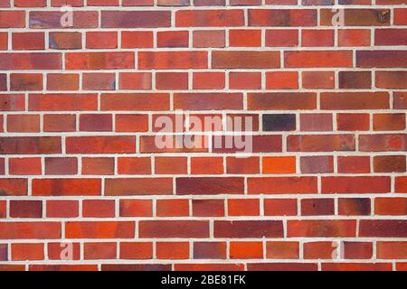 Sfondo da un muro di mattoni rossi pulito Foto Stock