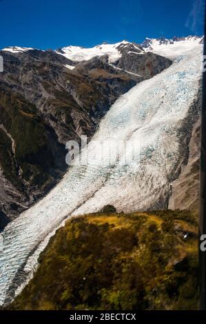 Vista aerea del Franz Joseph Glacier da un elicottero, Franz Joseph, South Island, in Nuova Zelanda. Foto Stock