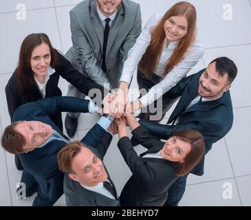 Team aziendale formata in un cerchio Foto Stock