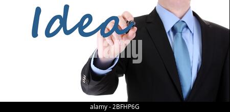 Uomo d'affari che scrive idea di parola su bordo trasparente Foto Stock