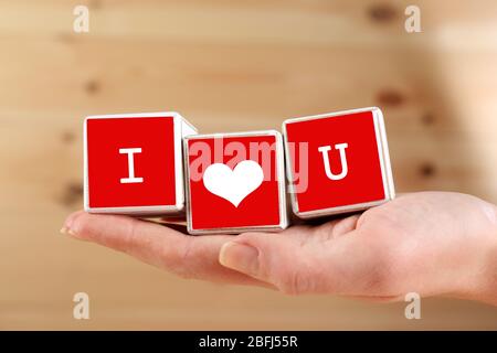 Ti amo scritto in blocchi di legno Foto Stock