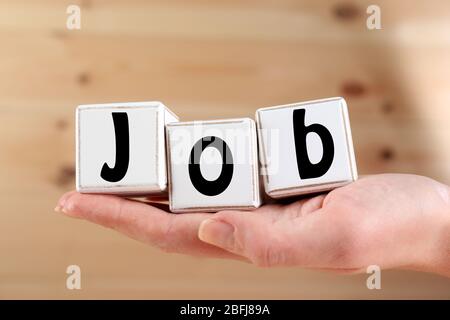 Parola di lavoro scritta con cubi di legno Foto Stock