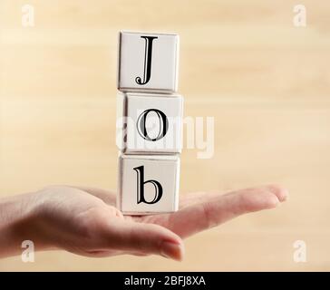 Parola di lavoro scritta con cubi di legno Foto Stock