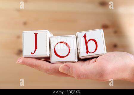 Parola di lavoro scritta con cubi di legno Foto Stock