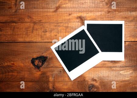 Carta fotografica su sfondo di legno Foto Stock