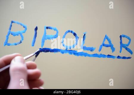 Bipolare scritto su specchio con vernice Foto Stock