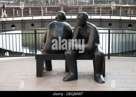 Giles Penny cifre sedute Cubitt Steps, Canary Wharf E14 Foto Stock