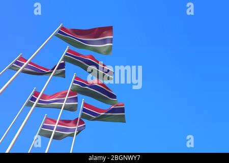 Le bandiere del Gambia che ondeggiavano nel vento contro un cielo blu. Rendering 3D Foto Stock