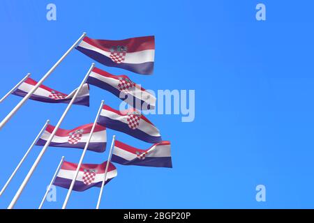 Le bandiere della Croazia sventolano contro un cielo blu. Rendering 3D Foto Stock