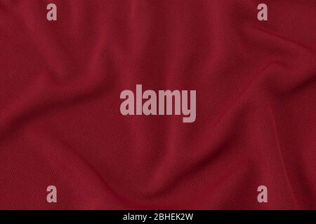 Abbigliamento sportivo tessuto trama sfondo. Camicia da calcio rossa, può essere utilizzata per il design. Foto Stock