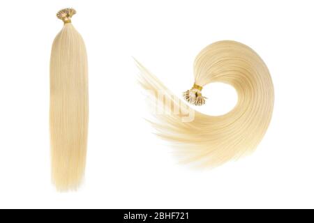 Set di due finte donne capelli estensioni in coda, isolato su sfondo bianco. Colore biondo chiaro o oro. Foto Stock