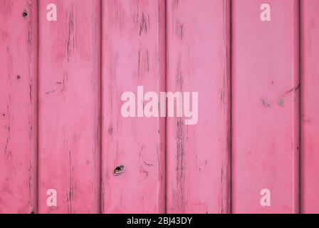 Colore rosa pastello sfondo di legno invecchiato con tavole verticali. Foto Stock