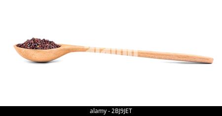 Semi di senape nera in cucchiaio su fondo bianco Foto Stock
