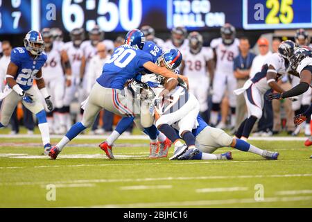 15 settembre 2013: Denver Broncos Wide Receiver Trindon Holliday (11) è affrontato da New York Giants Safety Cooper Taylor (30) e New York Giants tig Foto Stock