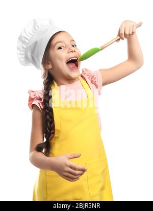 Ragazza carina in cappello chef con spatola, isolato su bianco Foto Stock