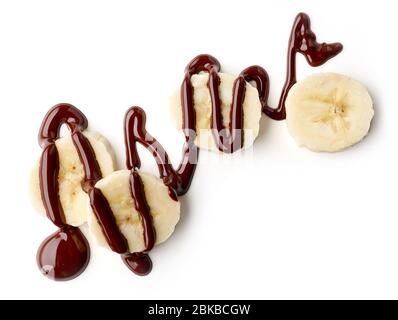 banana e cioccolato fuso isolato su sfondo bianco, vista dall'alto Foto Stock