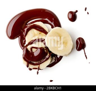 banana e cioccolato fuso isolato su sfondo bianco, vista dall'alto Foto Stock