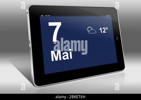 Un tablet visualizza un calendario in lingua tedesca con la data 7 maggio | Ein Tablet-computer zeigt das Datum 7. Mai Foto Stock