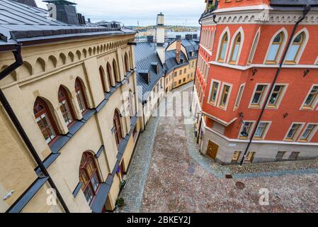 Tipico angolo di strada a Stoccolma, Svezia. E Bellmansgatan Pryssgrand, da Mariahissen, in Sodermalm. Novembre serata. Foto Stock