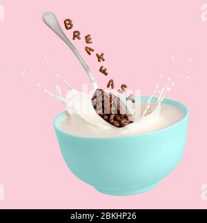 Lettere di cereali di cacao che cadono in una ciotola blu con il latte spruzzato. Colazione per bambini. Isolato su sfondo rosa. Foto Stock