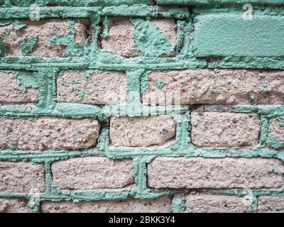 primo piano. frammento di un vecchio muro di mattoni. Foto Stock