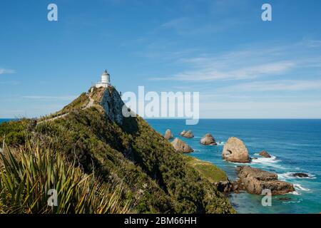 Faro di Nugget Point, Owaka, Nuova Zelanda Foto Stock