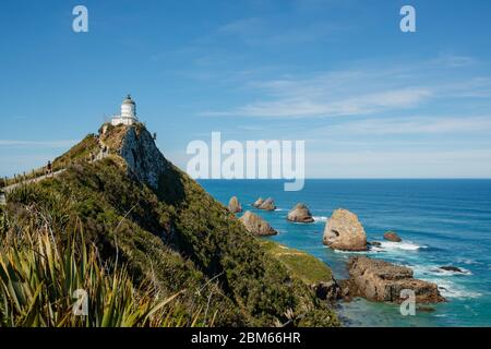 Faro di Nugget Point, Owaka, Nuova Zelanda Foto Stock