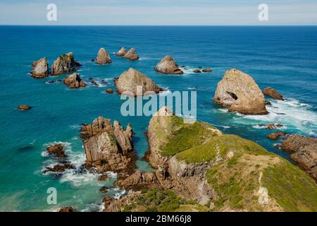 Faro di Nugget Point, Owaka, Nuova Zelanda Foto Stock