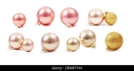 Set moderno di giocattoli in vetro monocromatici di Natale. Decorazioni natalizie, forme rotonde. Palline di vetro di Capodanno. Colori perla, rosa e oro. Stock Foto Stock