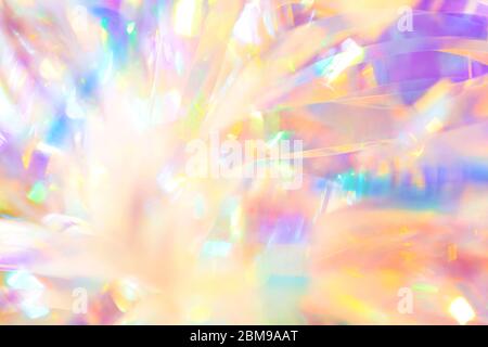 Felice calma dolce femminile blurred immagine di sfondo astratto fantasia olografica Natale nastro ornamento in lamina con bella luccicante borpa Foto Stock