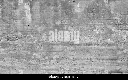 Struttura di parete in cemento vecchio e intemperie. Intonacatura è parzialmente sbucciata. Sfondo astratto ad alta risoluzione full frame in bianco e nero. Foto Stock
