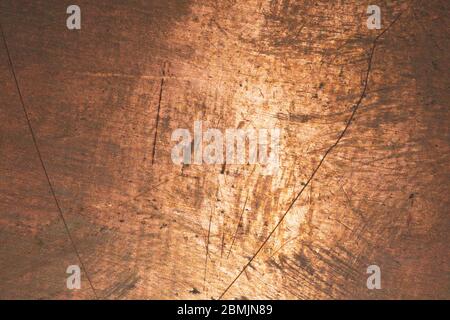 Superficie in rame. Fondo in bronzo. Lamiera con macchie e graffi. Grana marrone Foto Stock