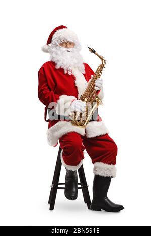 Babbo Natale che gioca il sax isolato su sfondo bianco Foto Stock