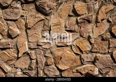 Marrone a muro di pietra sfondo texture Foto Stock
