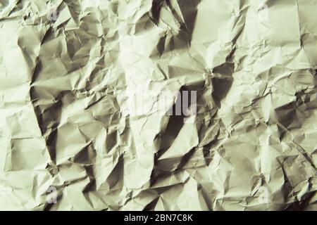 Sfondo di carta sgualcito. Colore verde chiaro. Foto Stock